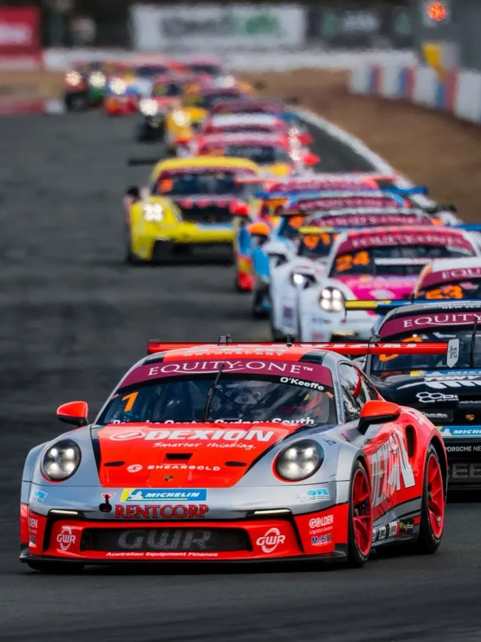 The Dexion Porsche 911 GT3 Cup car leading a queue of Carrera Cup cars